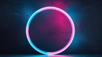 Glowing neon circle with pink and blue gradient on dark background photo