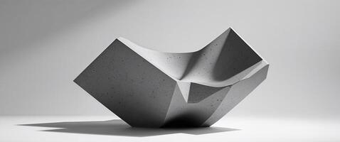 A sculpture made of concrete that is sitting on a table photo