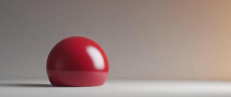 A red egg sitting on a table photo