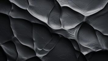 Abstract textured background featuring dark wrinkled surface depth and visual interest with shadows photo