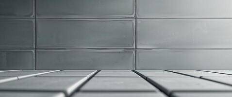 Decorative rectangular wall tiles in a muted gray tone. photo