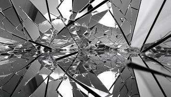 a broken scene through a shattered glass reflecting infinite dimensions photo