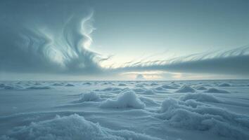 A large field of snow with clouds in the sky photo
