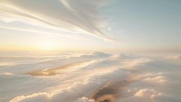 a glistening scene over a valley of clouds, where the sky meets the earth in a blur of white and gold photo