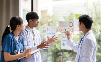Data-driven decisions in healthcare. Team analyzing health statistics photo