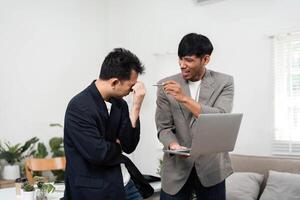 Business Challenge and Problem-Solving. Two colleagues expressing frustration during a discussion about project setbacks. photo