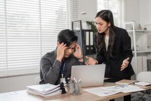 Professional colleagues addressing challenges in a modern office, emphasizing teamwork and effective communication. photo