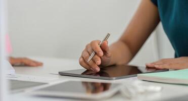 Sustainable Business Practices. Professional holding tablet with digital design for ESG initiatives. photo