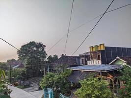 Quiet Village Residential Environment with Houses and Trees at Sunrise photo