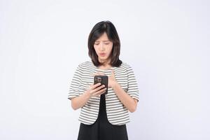 Southeast asian woman using mobile internet application with worried expression on white background photo