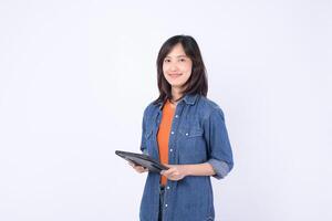 asian woman is small business owner working creatively in retail industry using tablet for her online store startup with confident and happy expression photo