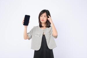 Southeast asian woman looks confused while holding mobile phone showing blank screen as she tries to use internet application on white background photo