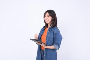 Southeast asian woman is small business owner working creatively on her online retail store startup using digital tablet for shopping and industry growth with bright smile photo