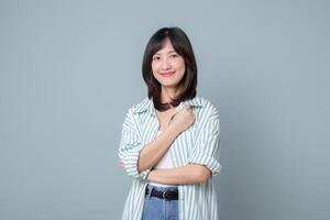 Southeast asian woman smiles confidently as small business owner in retail and online store industry showing creative spirit for her startup and shopping success photo
