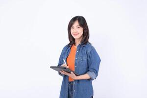 Southeast asian woman is small business owner working creatively in retail and online shopping startup industry using digital tablet for her store success photo