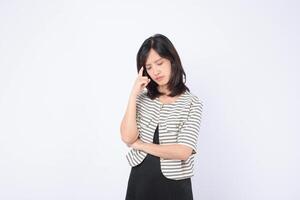 Southeast asian woman in striped jacket looks thoughtful and worried, expressing emotion for advertising or creative concept use photo