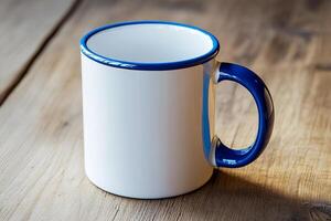 White coffee mug with glossy blue handle placed on table in soft light perfect for mockup or branding use photo