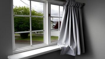 Serene Window View Grey Curtain Draped Green Trees Cloudy Sky Suburban Scene photo