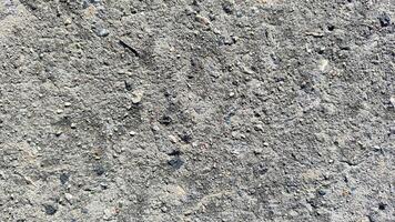 rough concrete and stone texture background, a natural and gritty surface for industrial and urban design projects photo