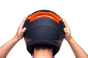 Back view of motorcyclist is wearing helmet. Concept, safety in transportation. Helmet helps prevent head injuries in accidents. Campaign to wear helmet when riding a motorcycle. photo