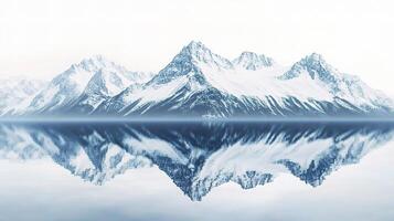 A mountain range is reflected in a lake photo