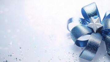 A blue and silver bow with a star on it photo