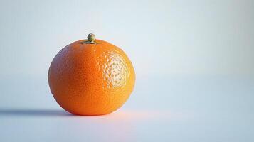 A single orange on a table photo