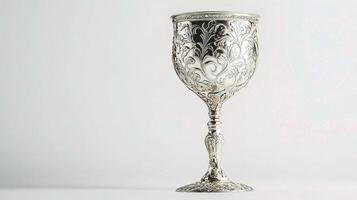 Ornate Silver Goblet with Intricate Floral Engravings Design photo