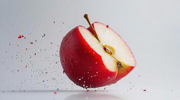 A red apple is being splashed with water photo
