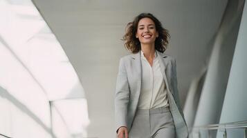 A woman in a business suit walking down a hallway photo