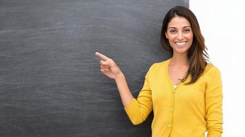 A woman pointing at a chalkboard photo