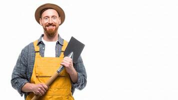 A man with a beard and hat holding a shovel photo