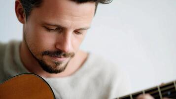 A man with a beard and a guitar photo