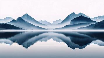 A lake with mountains reflected in it photo