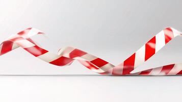 Red and white striped ribbon on a white background photo