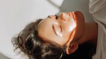 A woman laying down with her eyes closed photo