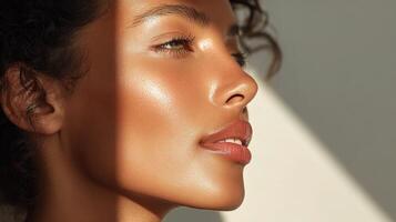 A woman with curly hair and a sun tan photo