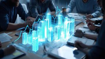 Business people working on a table with graphs and business charts photo