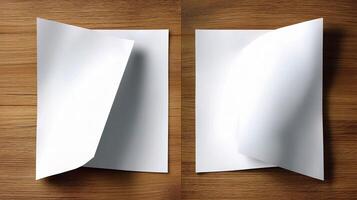 Two folded white paper on a wooden table photo