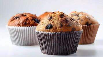 Three muffins are shown in a paper cup photo