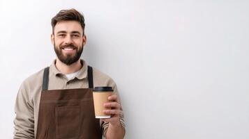 A bearded man holding a cup of coffee photo