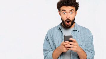 A man with a beard and a beard is holding a cell phone photo