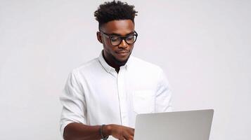A man in glasses is using a laptop photo