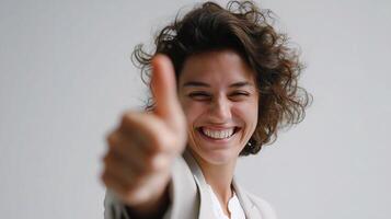 A woman is giving the thumbs up sign photo