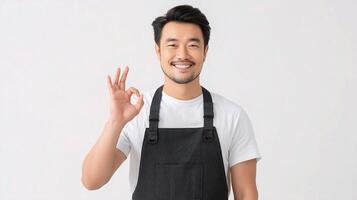 Asian male chef showing ok sign with his hand photo