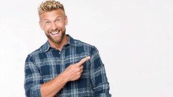 A man with a beard and a plaid shirt pointing at something photo