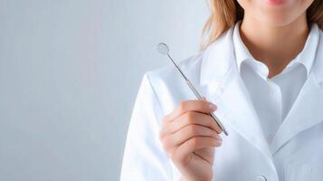 A woman in a white coat holding a toothbrush photo