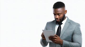 A man in a suit is using a tablet photo
