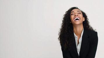 A woman laughing in a suit and tie photo