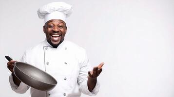A man in a chef hat holding a pan photo